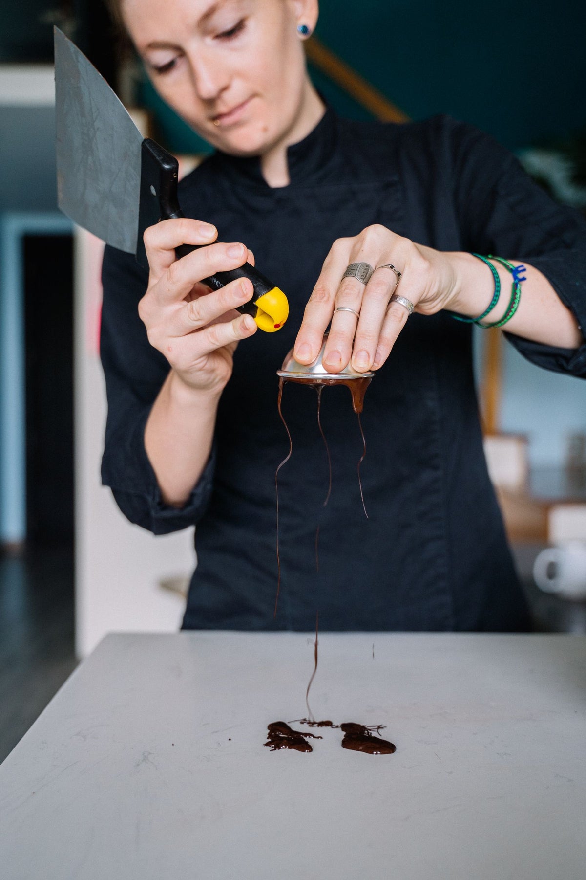Chocolatier tempering chocolate, illustrative stock photograph